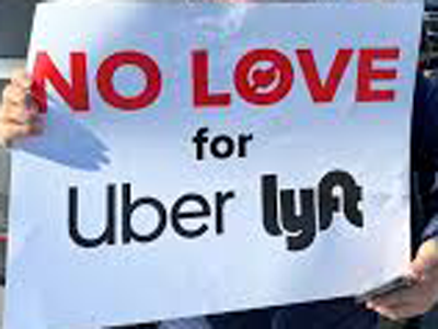 Drivers in NYC protest sign against Uber